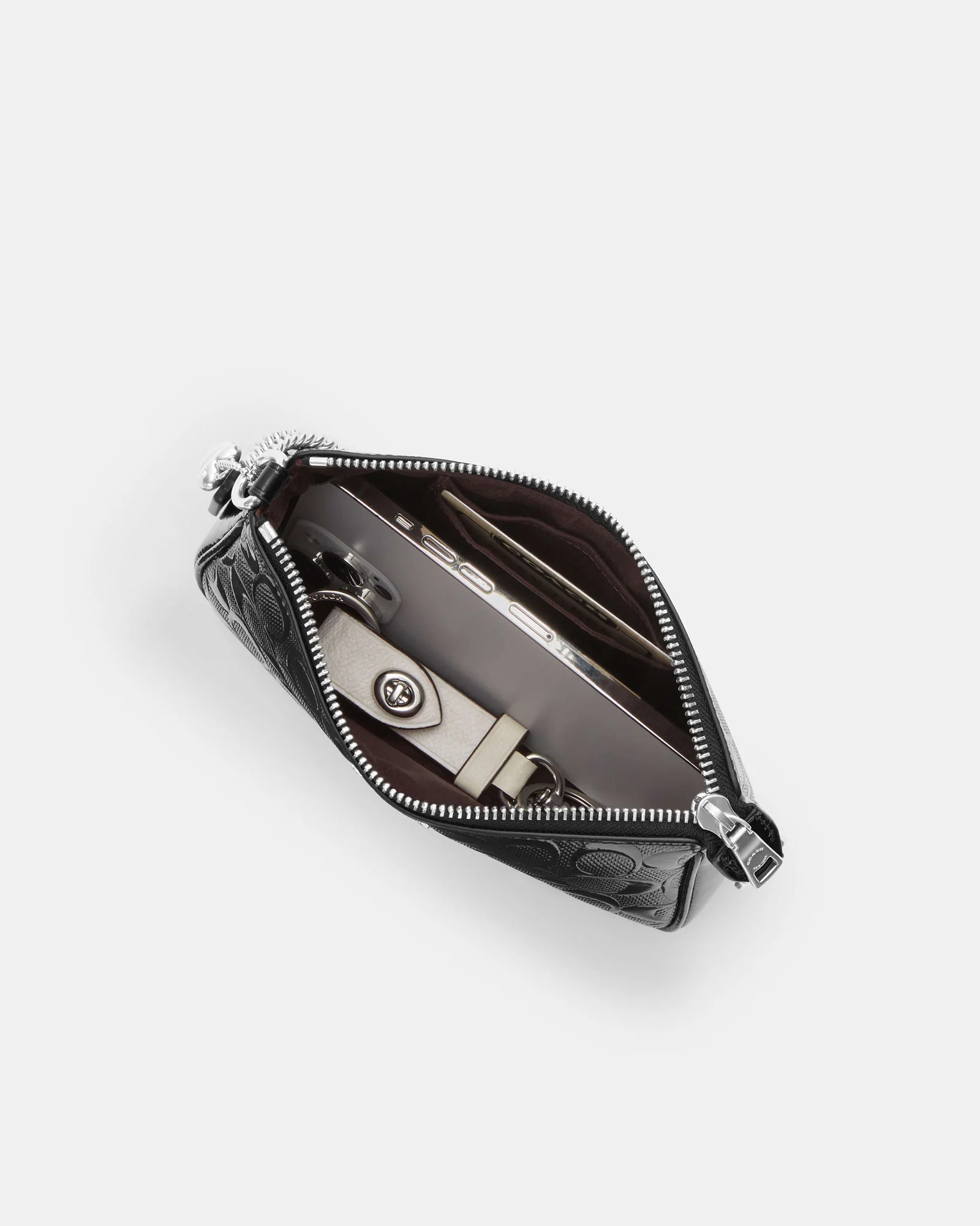 Сумка через плечо Coach Nolita 19 Signature Canvas — 19