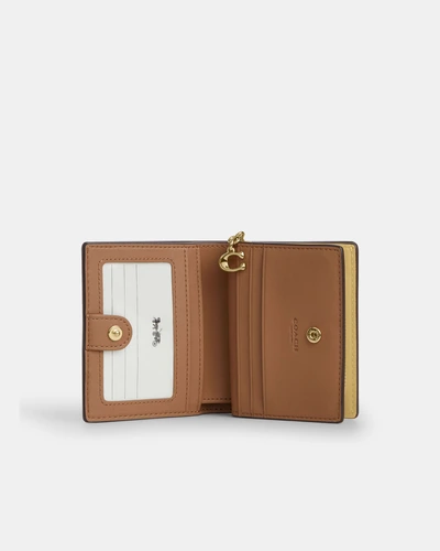 Кожаный кошелёк на кнопке Coach с брелоком