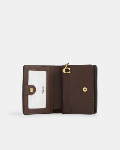 Кошелёк на кнопке Coach с фирменным узором