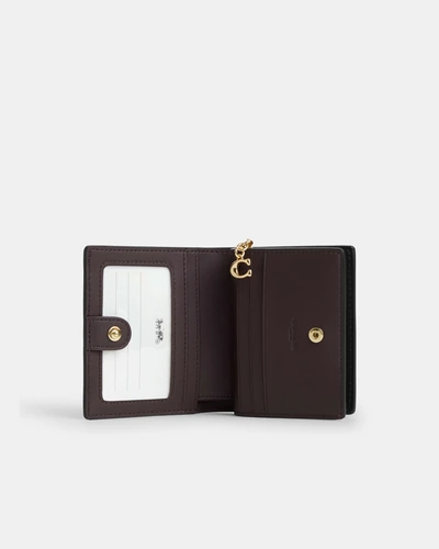 Небольшой кошелёк Coach на кнопке с фирменным принтом