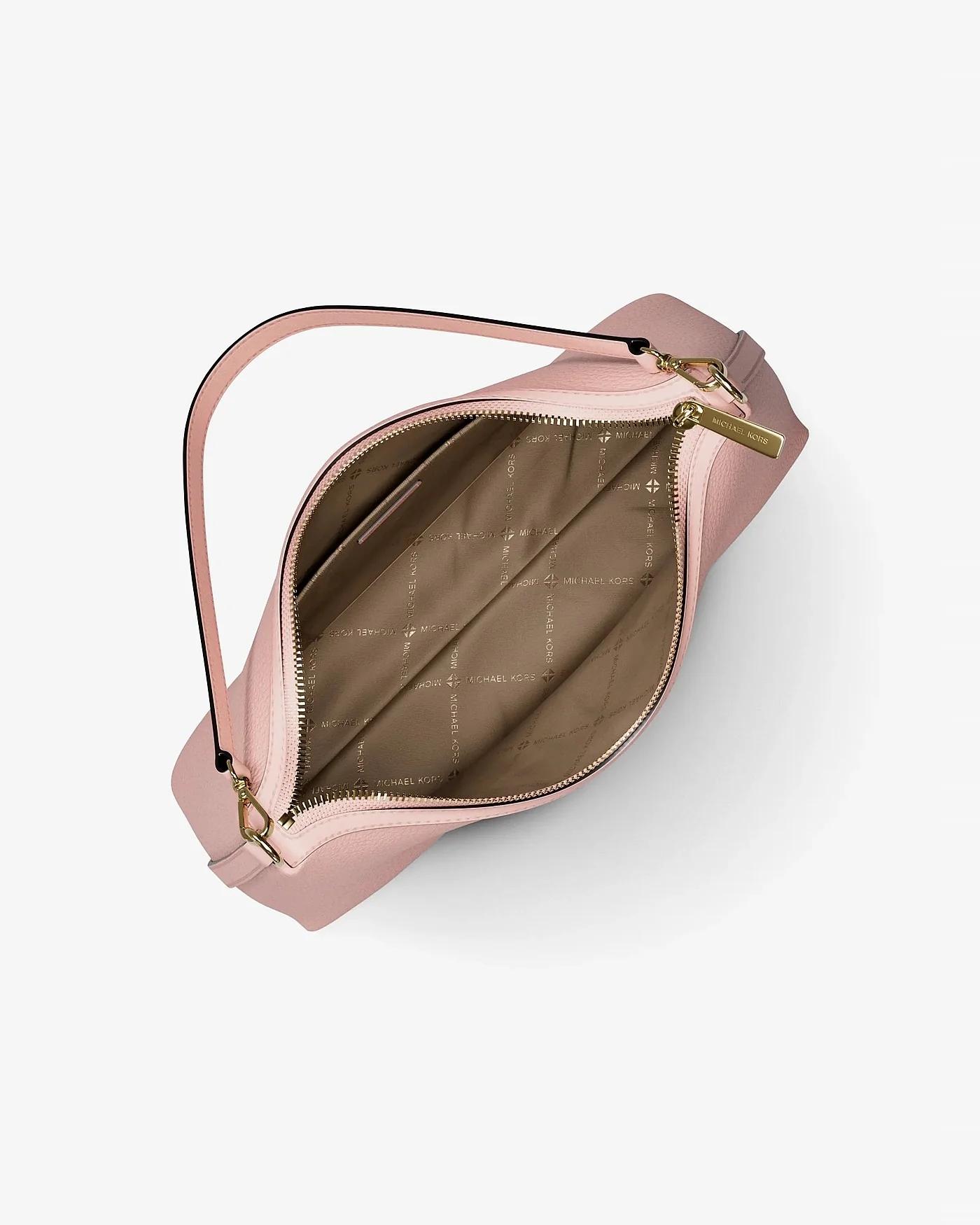 Открытая внутренняя часть розовой сумки Michael Kors Sammy с коричневым стёганым подкладом.