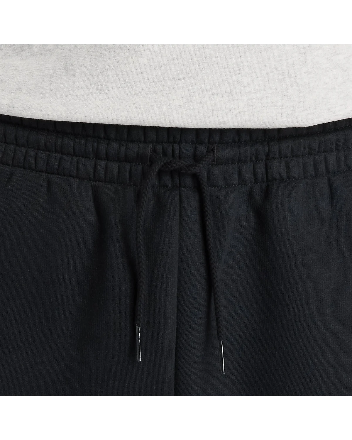Чёрные спортивные брюки New Balance, вид сзади