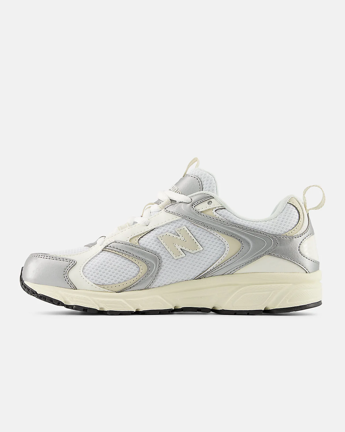 Вид сбоку серых кроссовок New Balance 408 с видимой подошвой и пяточной частью.