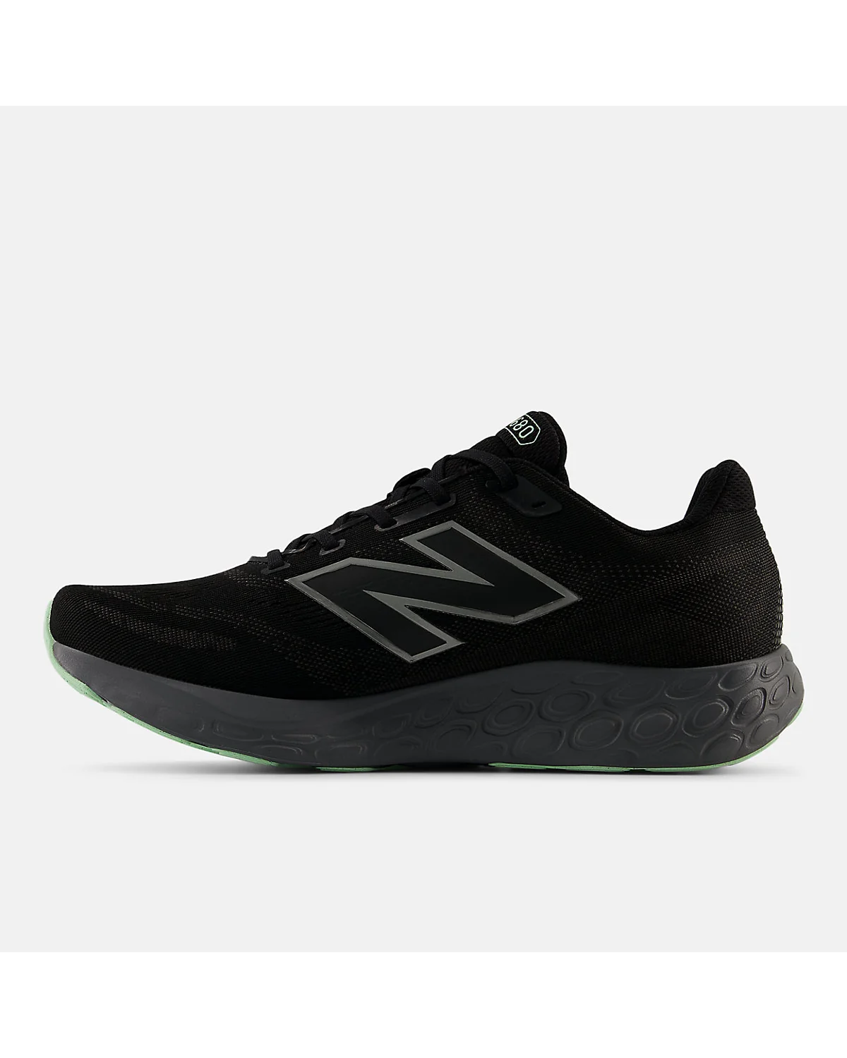 Подошва кроссовок New Balance Fresh Foam 680v8 с зелёным резиновым краем и серой основой.