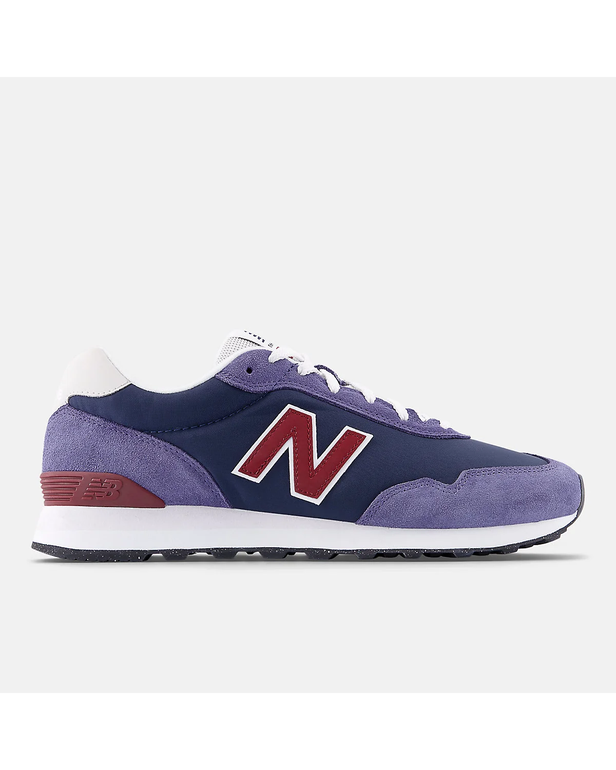 Кроссовки New Balance 515 в тёмно-синем и голубом цветах с красными деталями, вид сбоку.