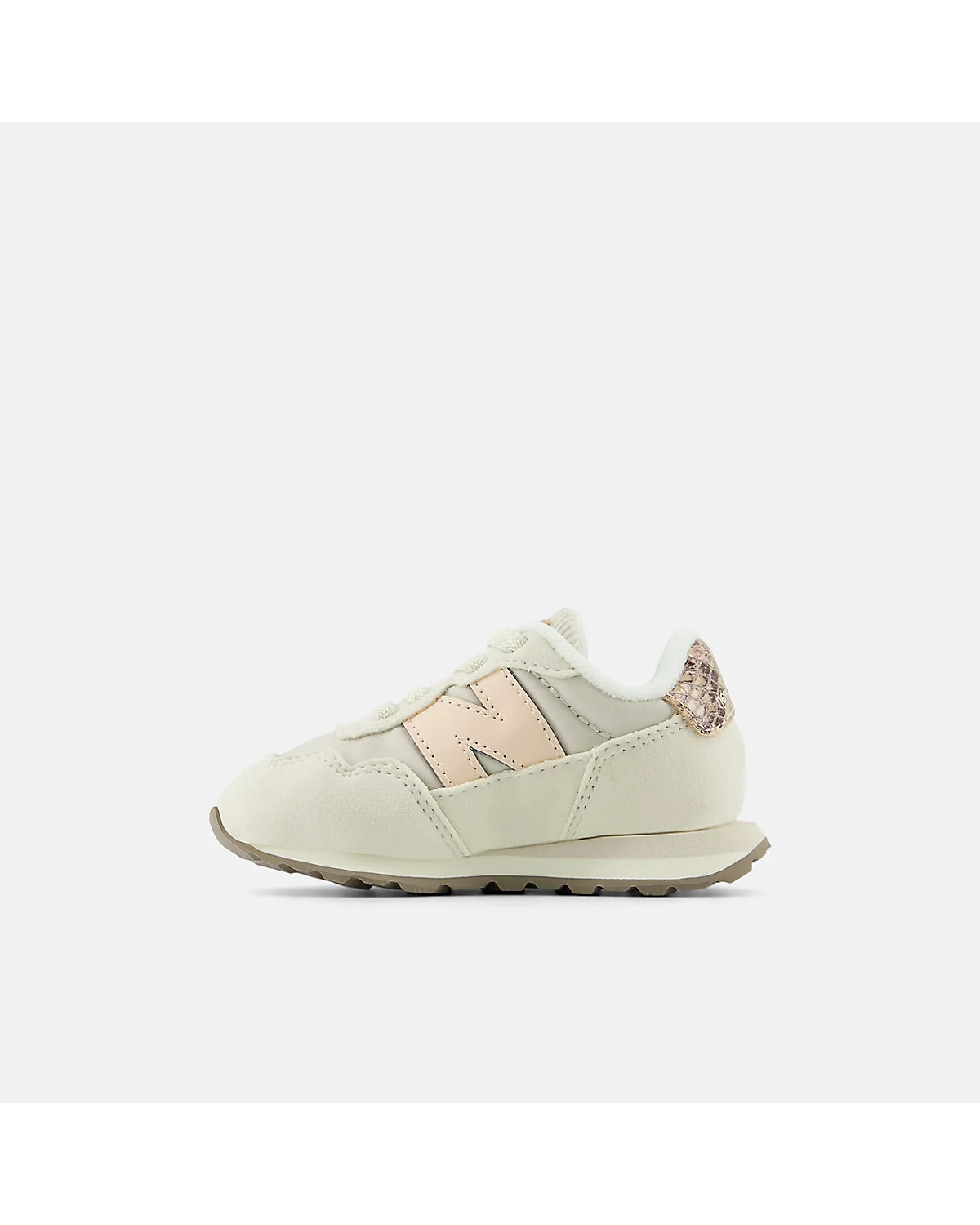 Детские кроссовки New Balance 237 бежевые с розовым, вид в три четверти