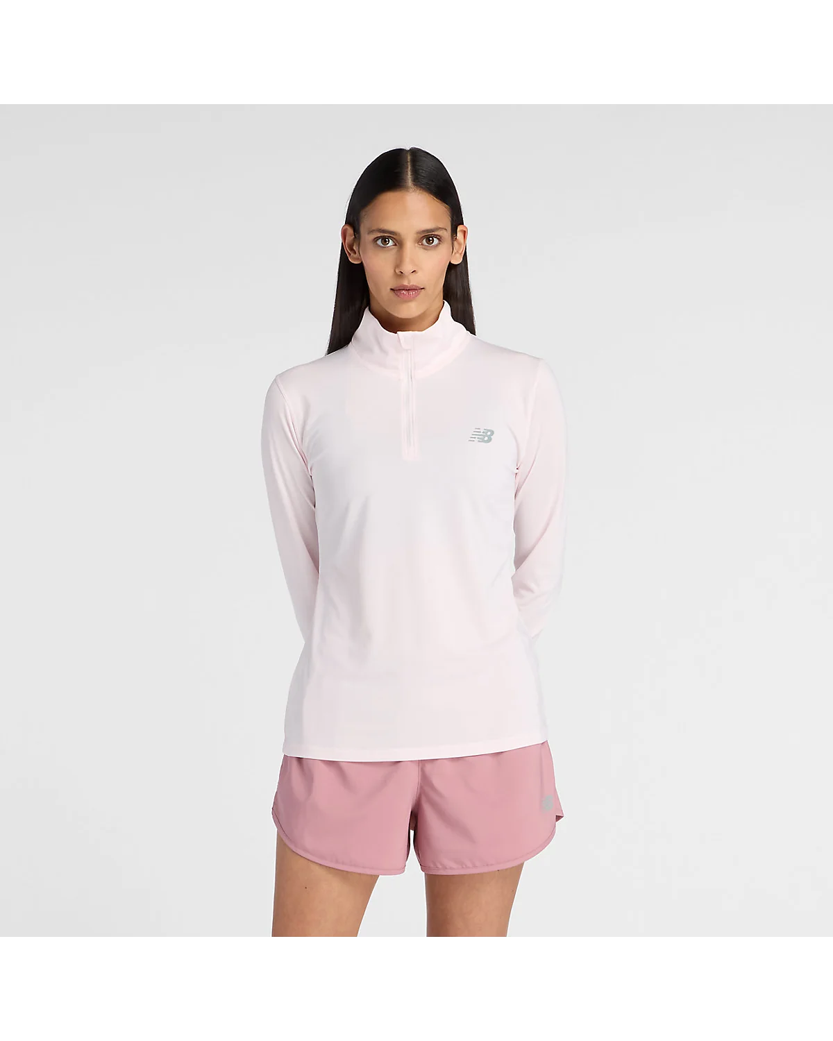 Розовая спортивная кофта New Balance Sport 1/4 Zip с четвертьмолнией, вид спереди.