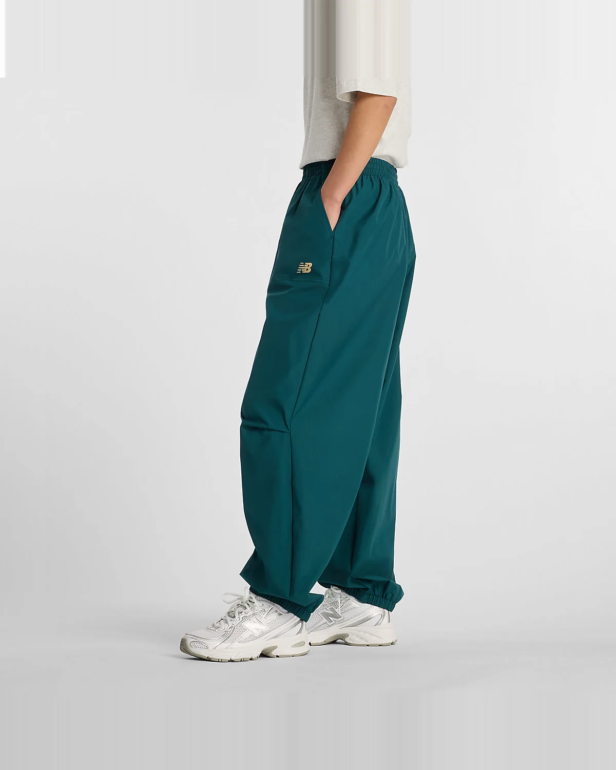 Женские брюки New Balance Trackside Woven — 5