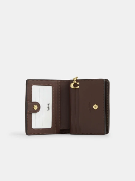 Кошелёк на кнопке Coach с фирменным узором