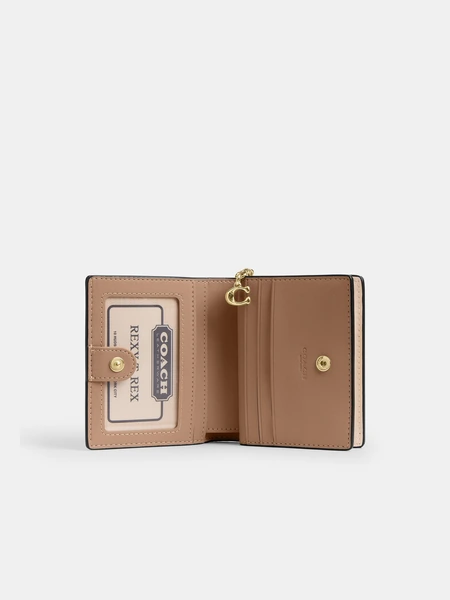 Кошелёк Coach на кнопке с цветочным принтом и подвеской
