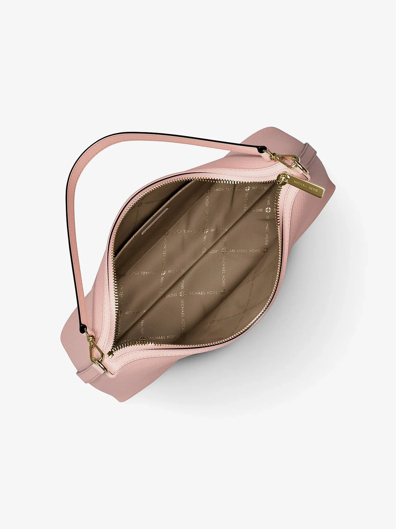 Открытая внутренняя часть розовой сумки Michael Kors Sammy с коричневым стёганым подкладом.