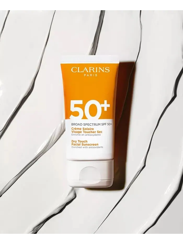 Солнцезащитный крем для лица Dry Touch широкого спектра SPF 50+, 1,7 унции Clarins — изображение 5 из 7