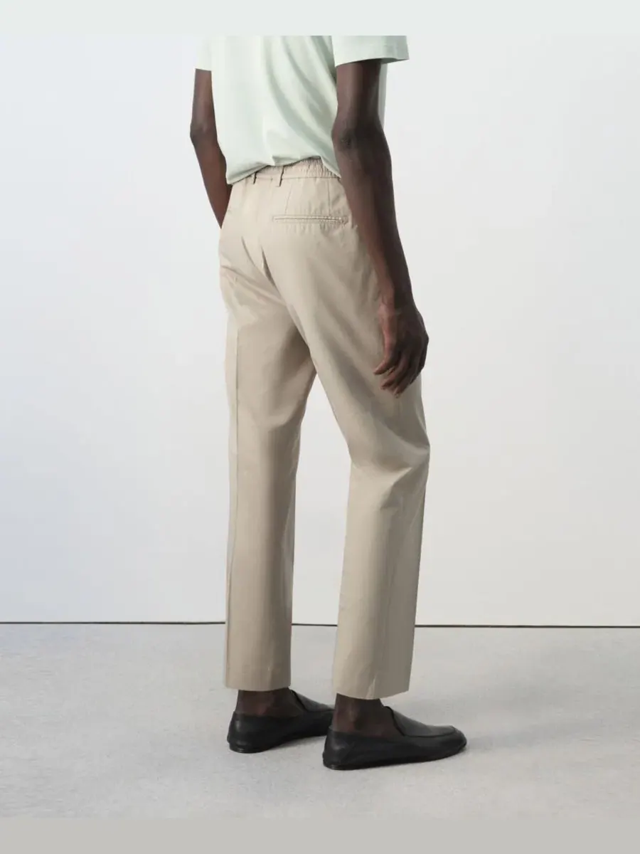 Брюки зауженные укороченные из хлопка и лиоцелла Slim Fit MANGO — изображение 7 из 7, коричневый