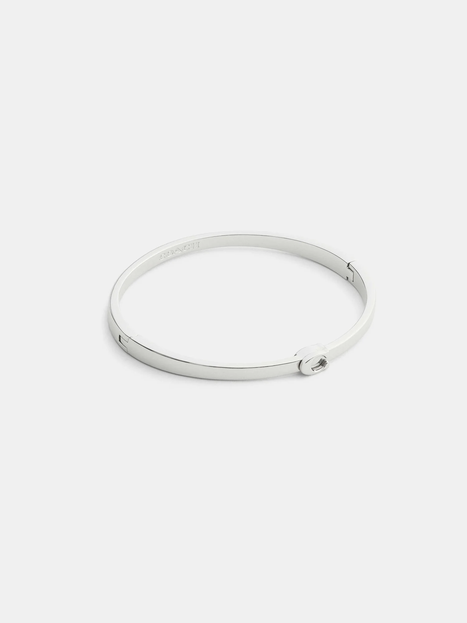 Тонкий браслет-бэнгл Coach с фирменным узором — 1