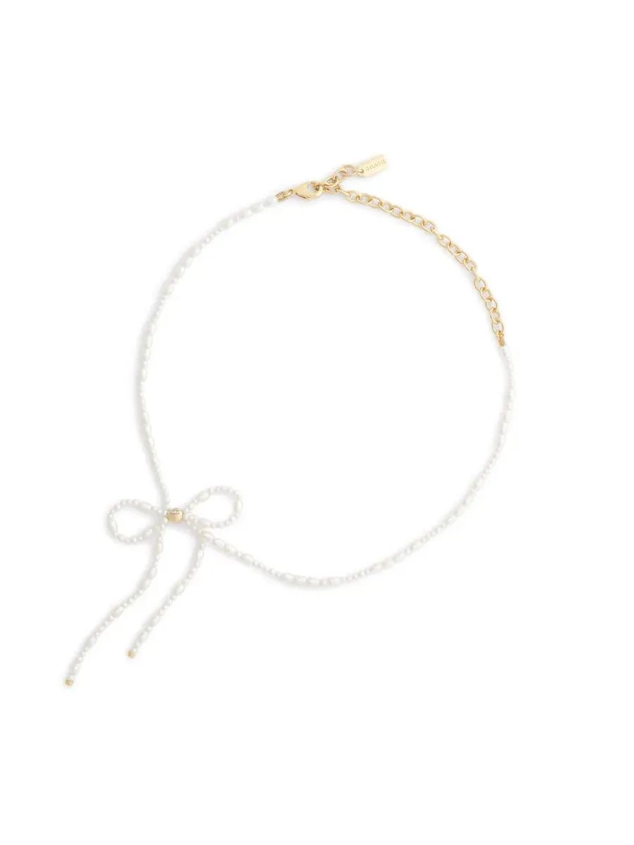 Колье-чокер с имитацией жемчуга в виде банта, модель Bow Choker COACH