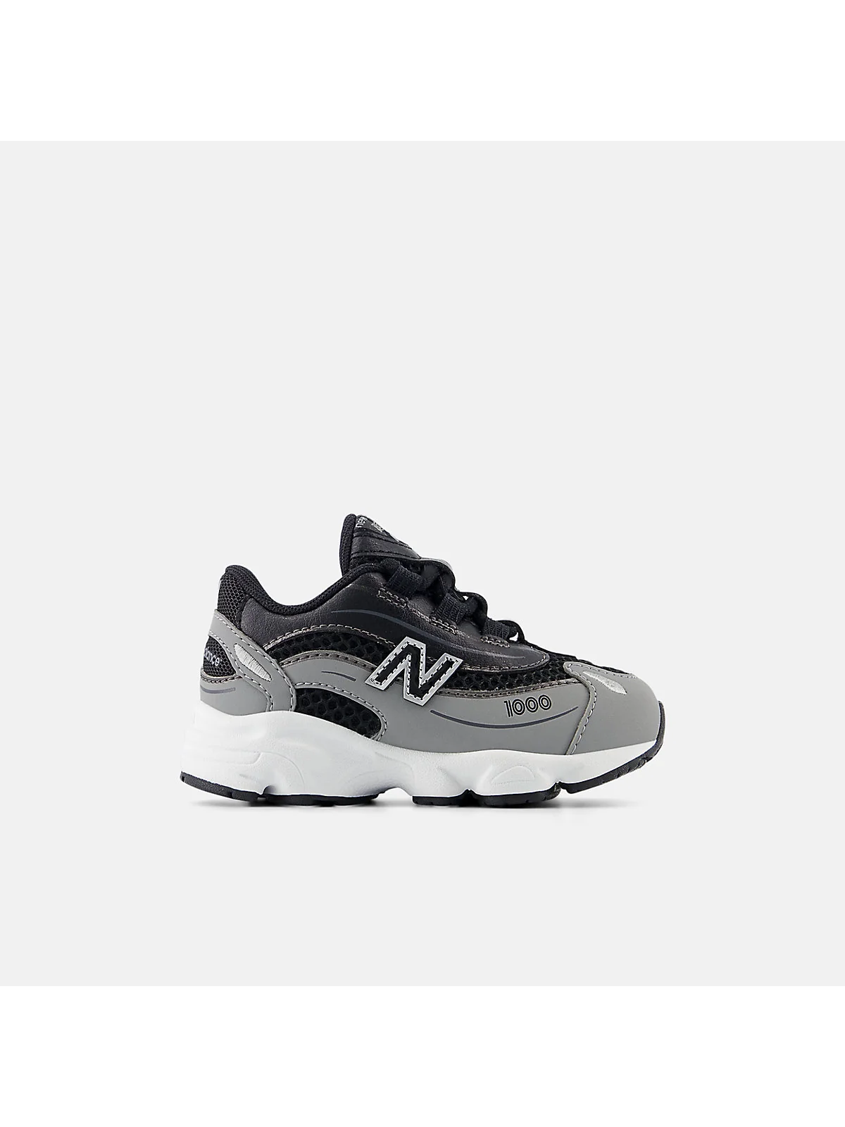 Кроссовки New Balance 1000 Bungee Lace бежевые с серебристыми вставками.