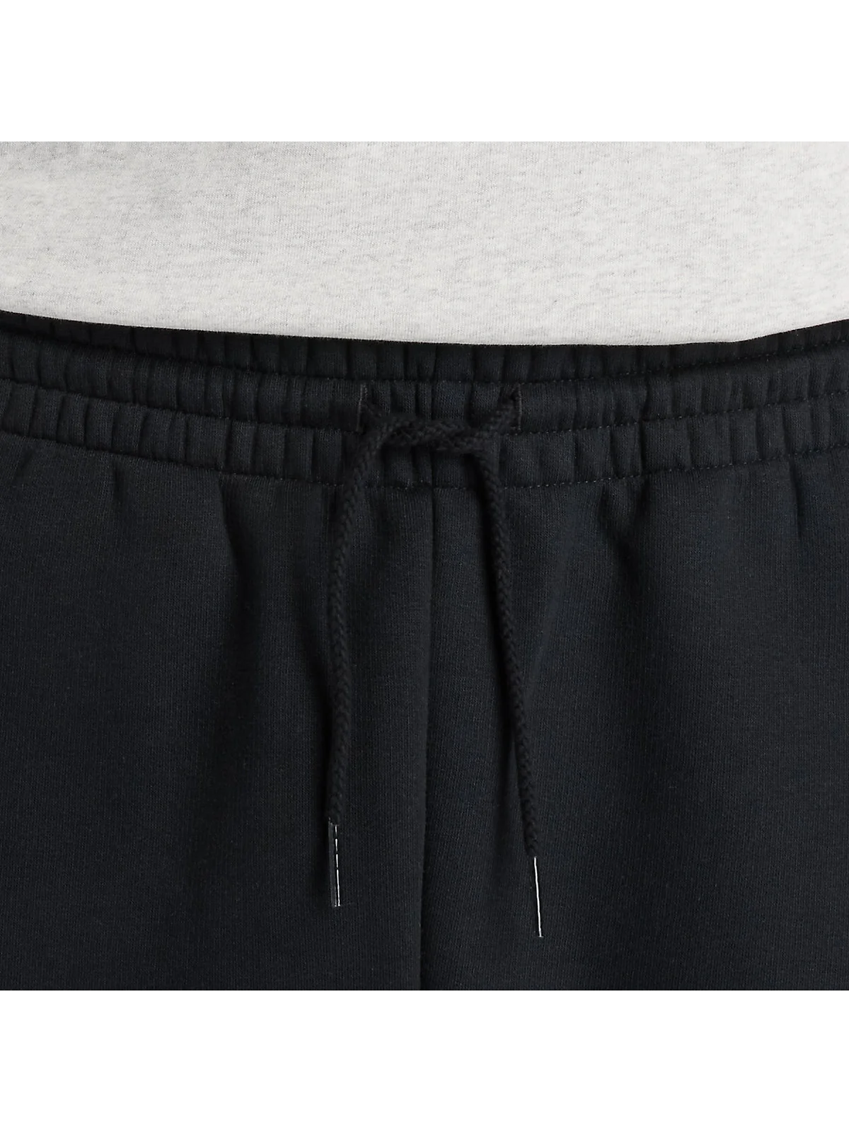 Чёрные спортивные брюки New Balance, вид сзади