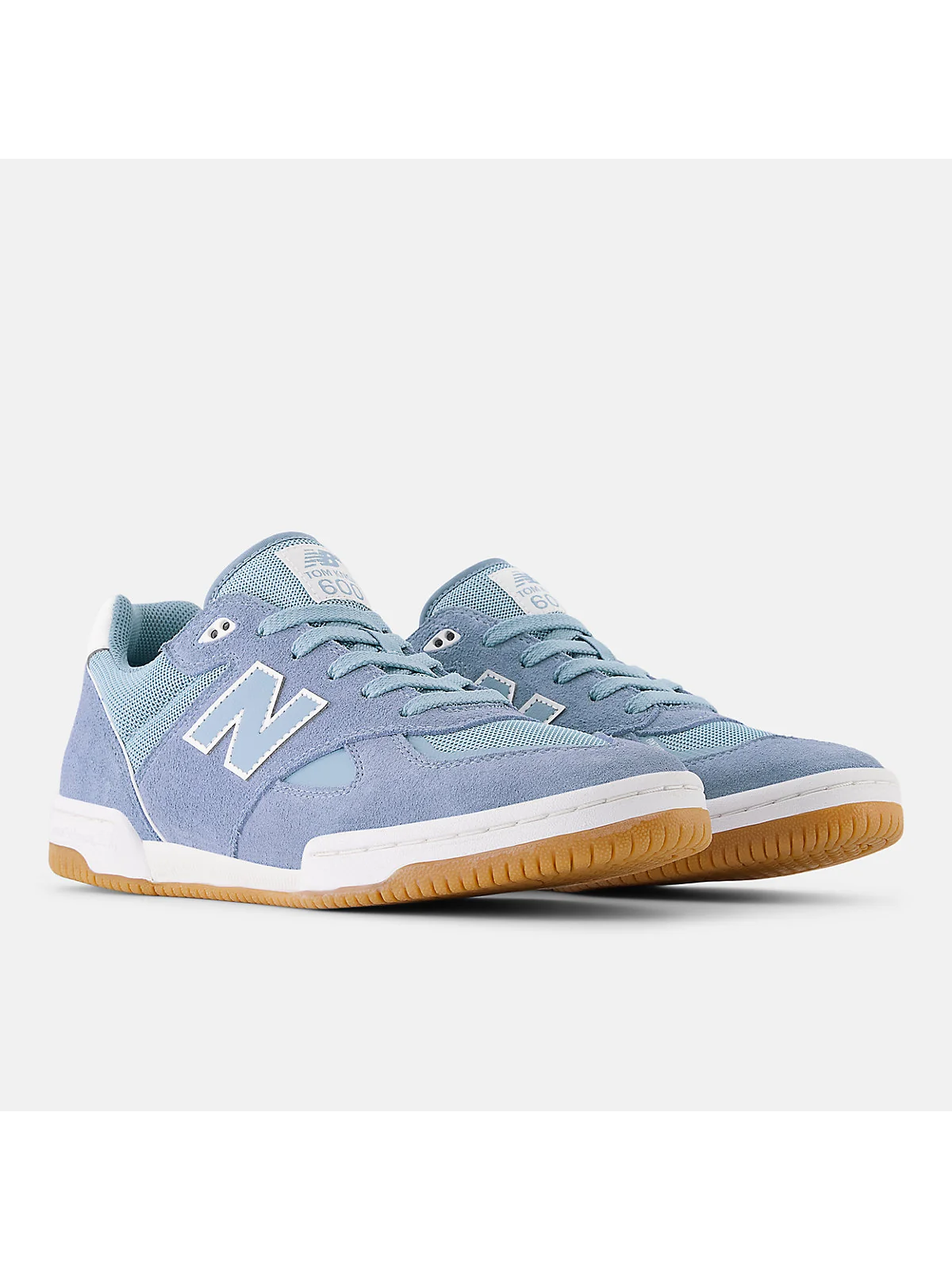 Чёрные кроссовки New Balance Tom Knox 600, боковой вид с оранжевым