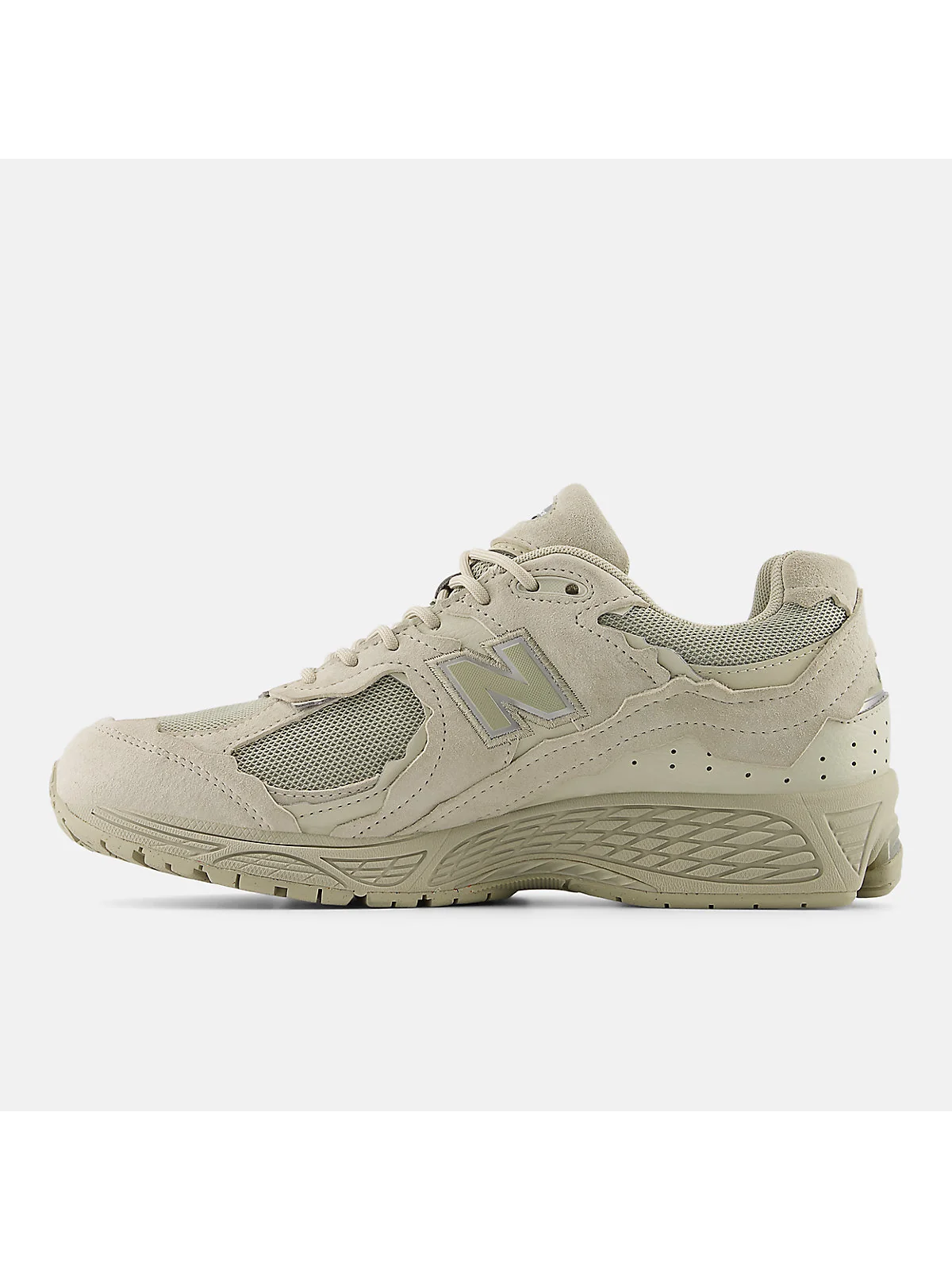 Белые кроссовки New Balance 2002DX сзади, видна пятка и структура панелей.