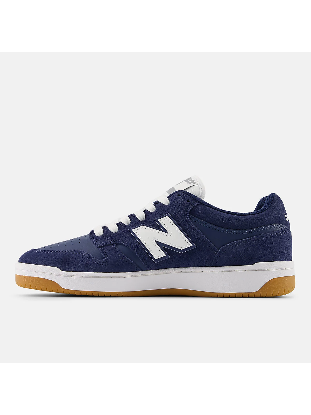Профильный вид с деталями конструкции тёмно-синих кроссовок New Balance 480.