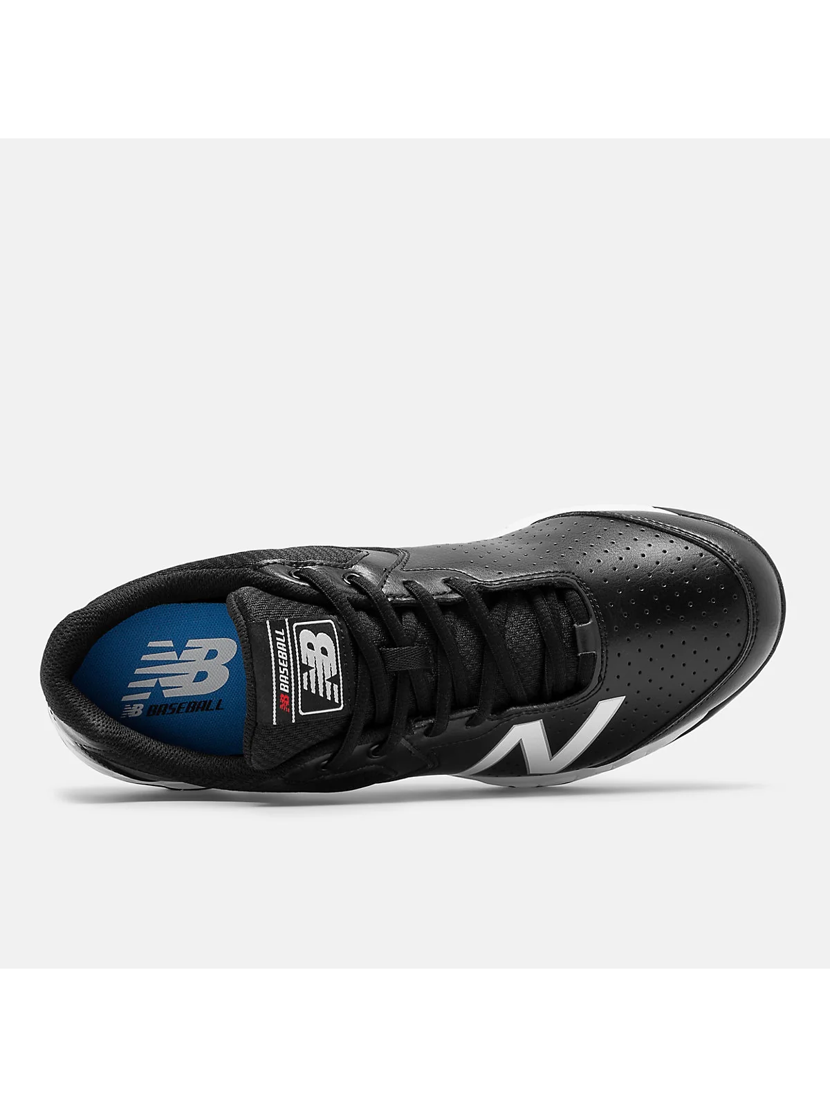 Крупный план материала New Balance 950v3: чёрная сетка, логотип и подошва.