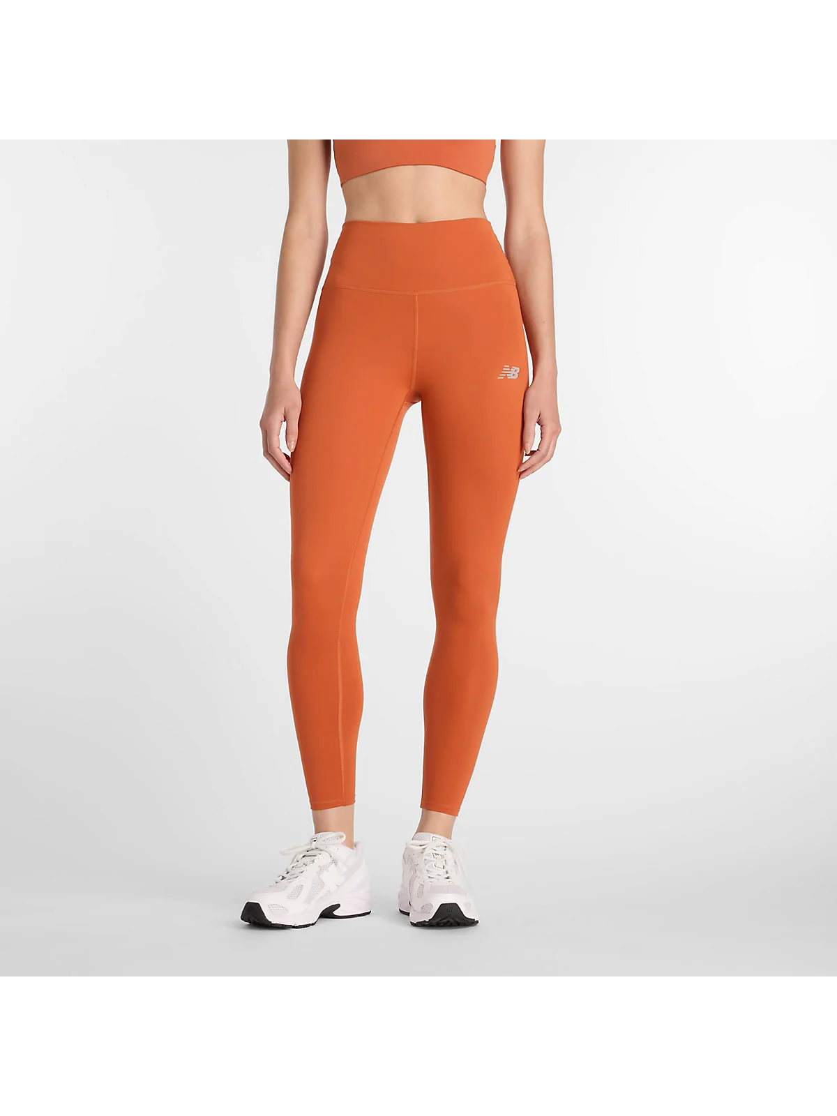 Леггинсы New Balance Harmony цвета корицы с высокой талией, вид спереди.