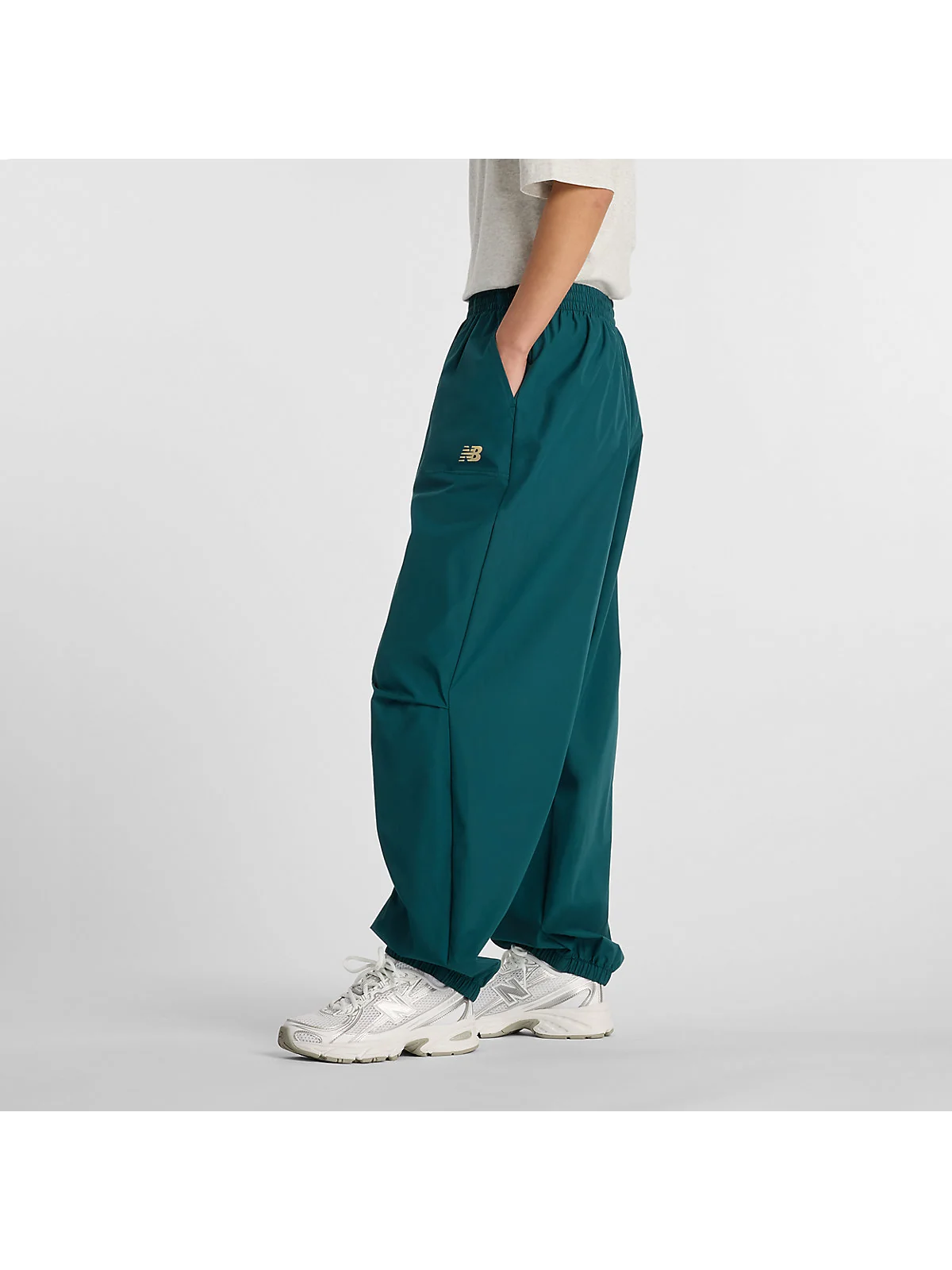 Женские брюки New Balance Trackside Woven — 5