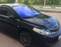 Накладки на передние фары (реснички) для Nissan Tiida (хэтчбек) 2008-2014
