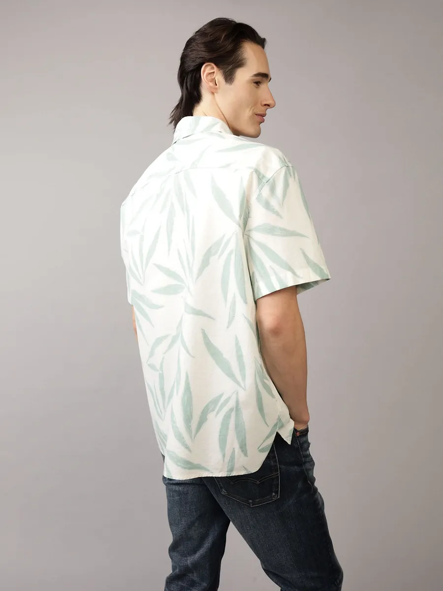 American Eagle MEN PALMER LEAVES SS OVERSIZED CSC 32S POPLIN REVERSE PRINT 333 JADE American Eagle MEN PALMER LEAVES SS OVERSIZED CSC 32S POPLIN REVERSE PRINT 333 JADE