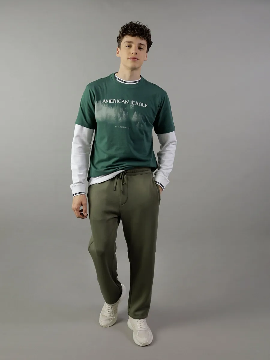 AMERICAN EAGLE MEN G INTL SS SET IN TEE- PC DYE + SERIOUSLY SOFT WASH 300 GREEN