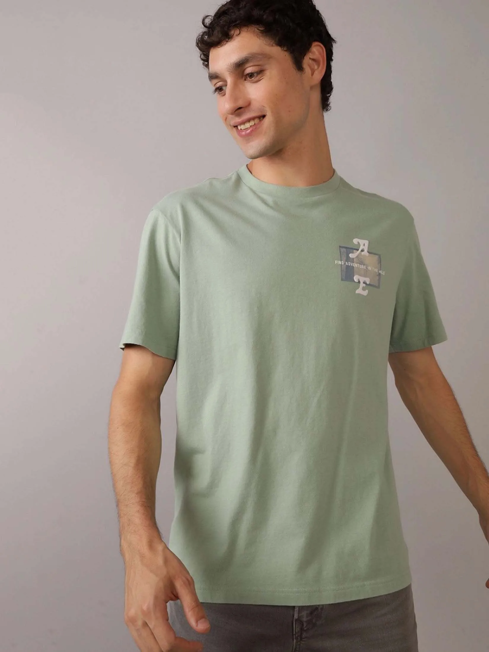 AMERICAN EAGLE MEN G SS BTS3 ELEV SET IN TEE- PC DYE + SERIOUSLY SOFT WASH 309 OLIVE