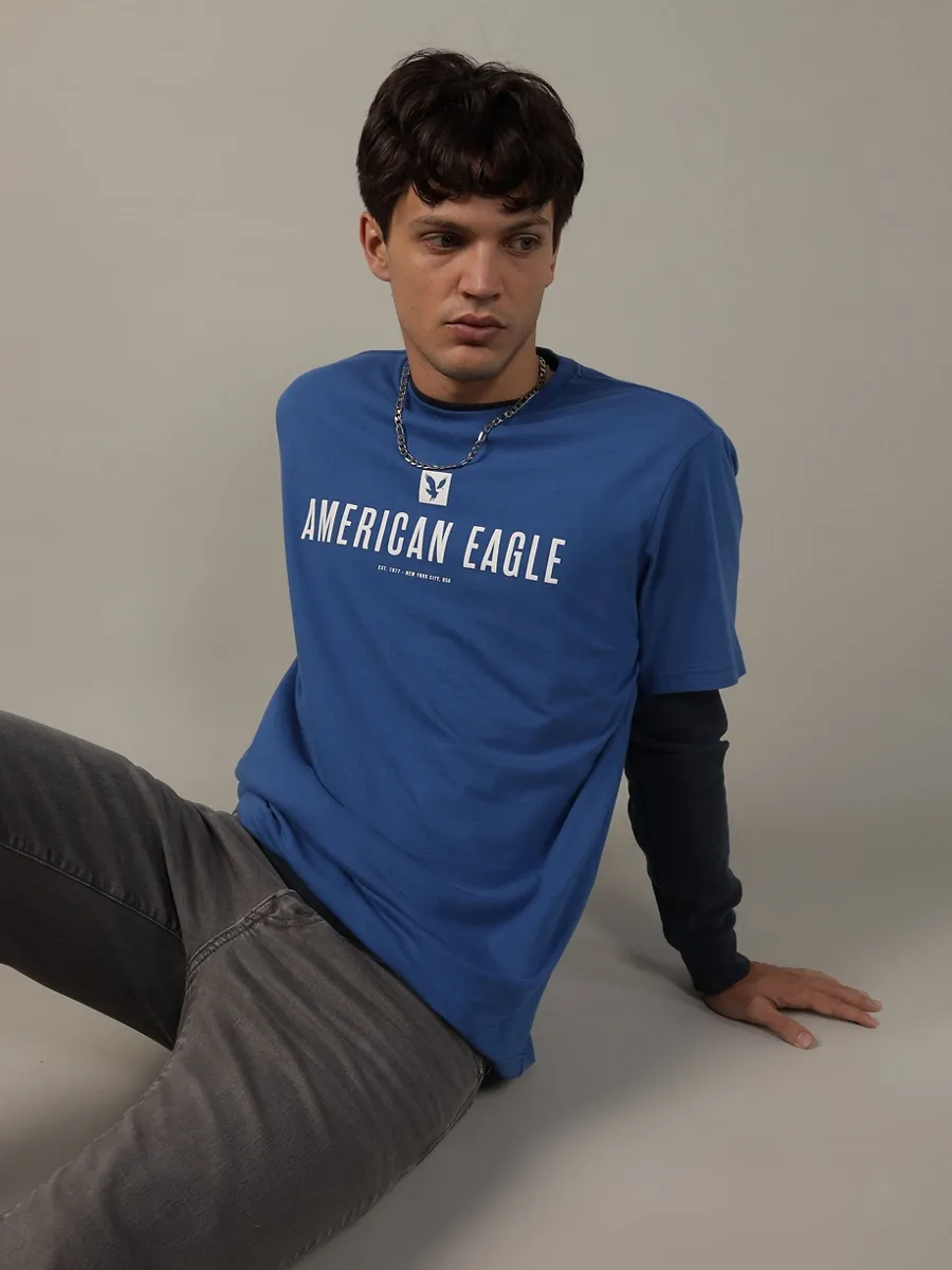 AMERICAN EAGLE MEN G SS CORE BRAND SET IN TEE- PC DYE + SERIOUSLY SOFT WASH 423 BRILLIANT BLUE