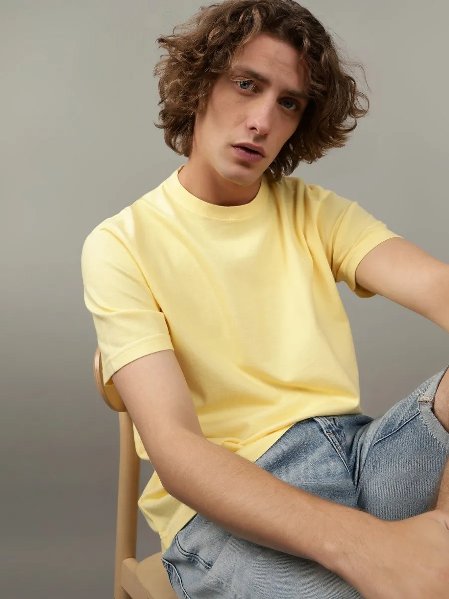 AMERICAN EAGLE MEN K - INTL SS BUTLER TEE RGD 799 YELLOW INFUSION
