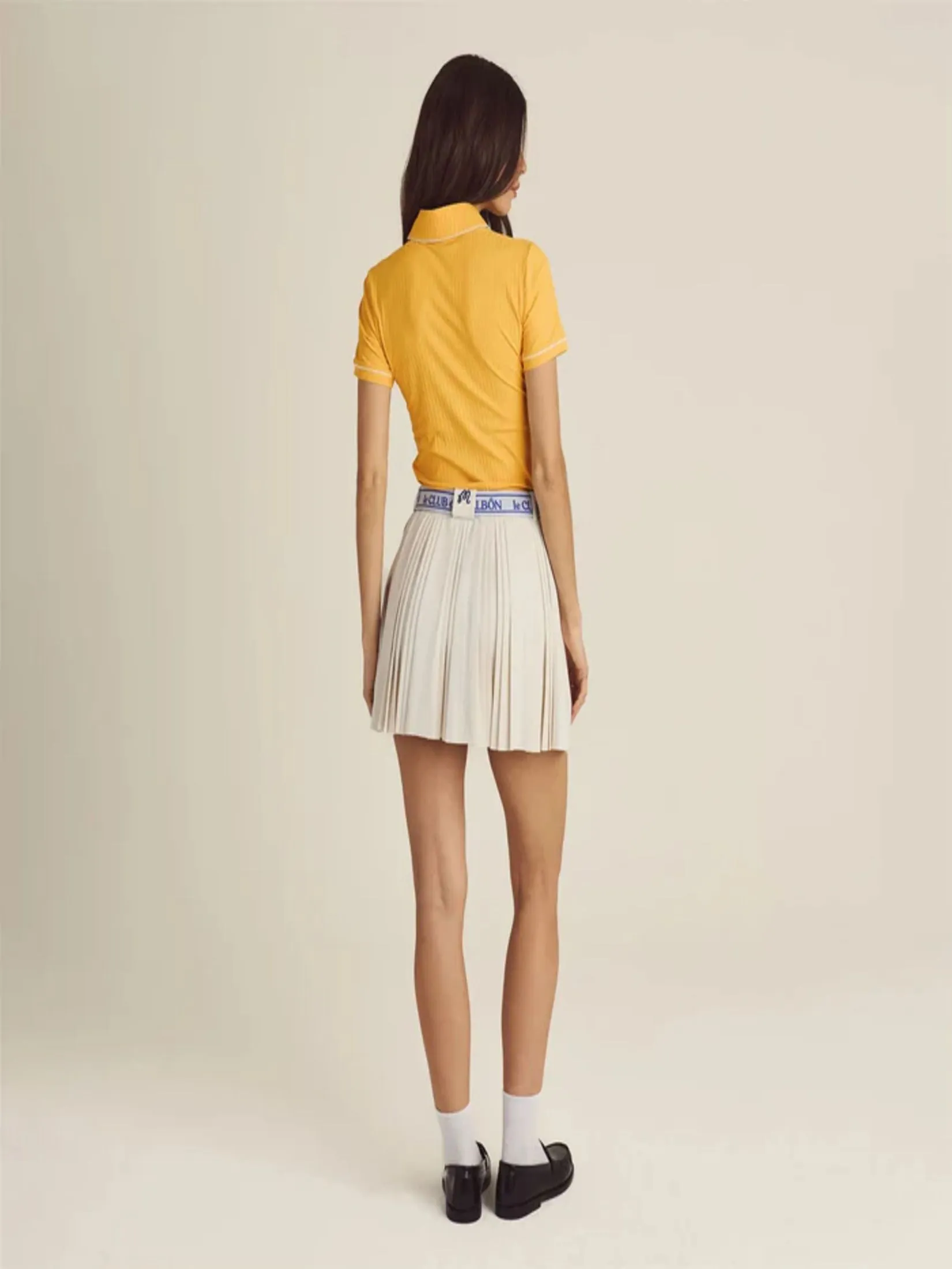 MALBON GOLF JOELLE PLEATED SKIRT IN IVORY