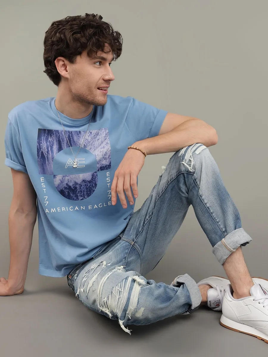 AMERICAN EAGLE MEN G SS PHOTOREAL SET IN TEE- PC DYE + MAGIC WHITE TUMBLE 415 TIDAL BLUE