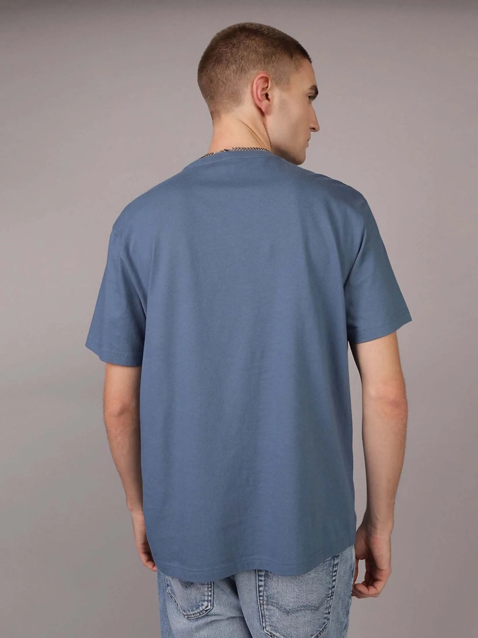 AMERICAN EAGLE MEN G SS HOL1 INTL/MFO SET IN TEE- PC DYE + MAGIC WHITE TUMBLE 410 NAVY