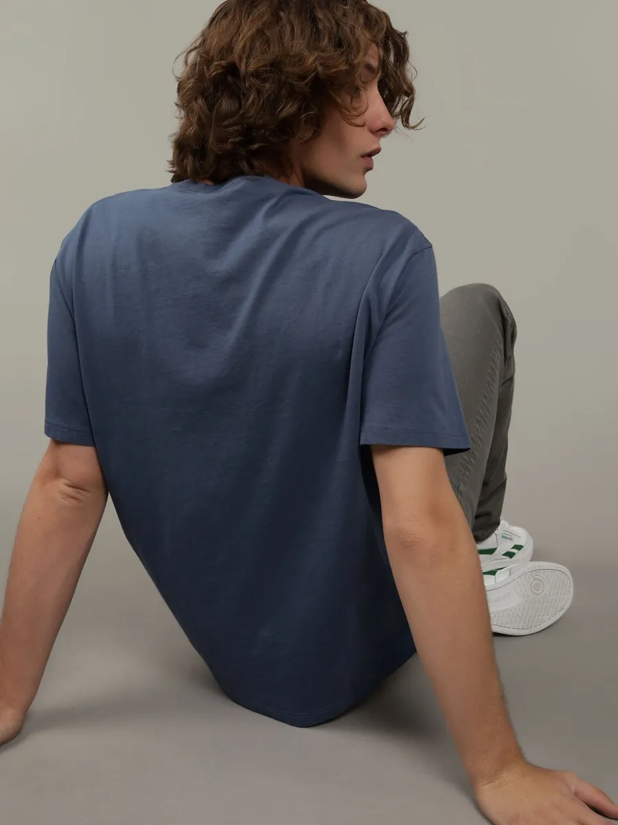 AMERICAN EAGLE MEN G SS SUM 2 OMNI SET IN TEE- PC DYE + SERIOUSLY SOFT WASH 400 BLUE