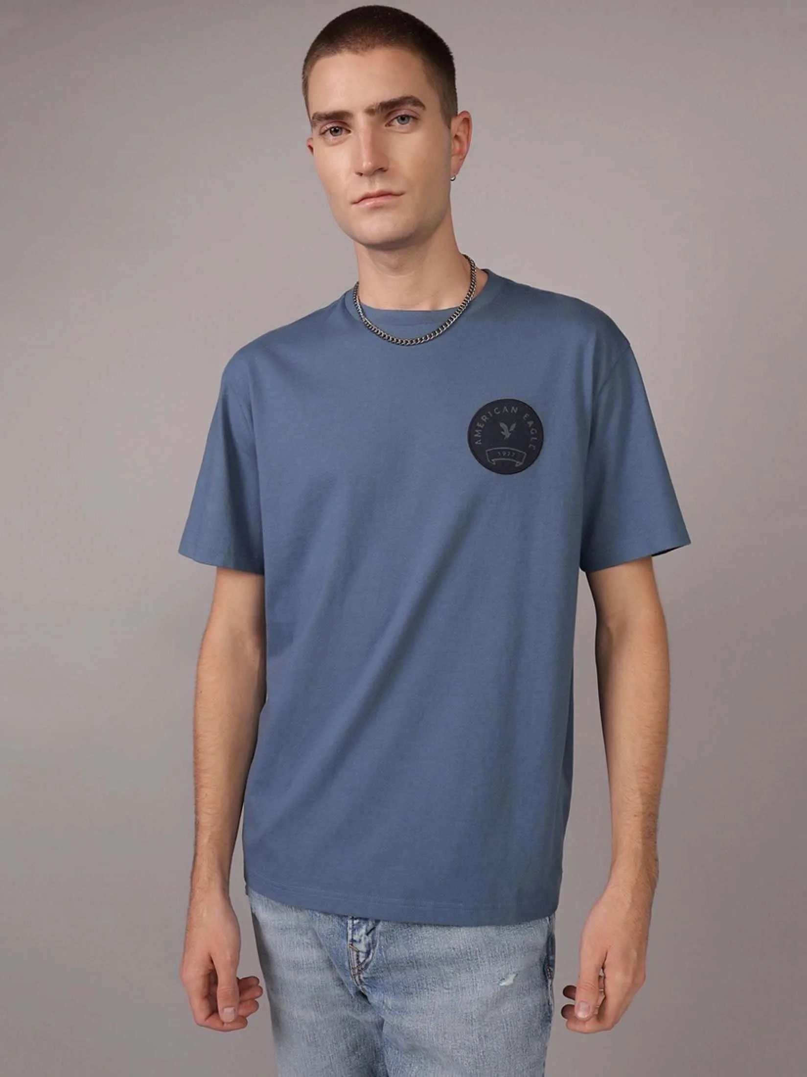 AMERICAN EAGLE MEN G SS HOL1 INTL/MFO SET IN TEE- PC DYE + MAGIC WHITE TUMBLE 410 NAVY