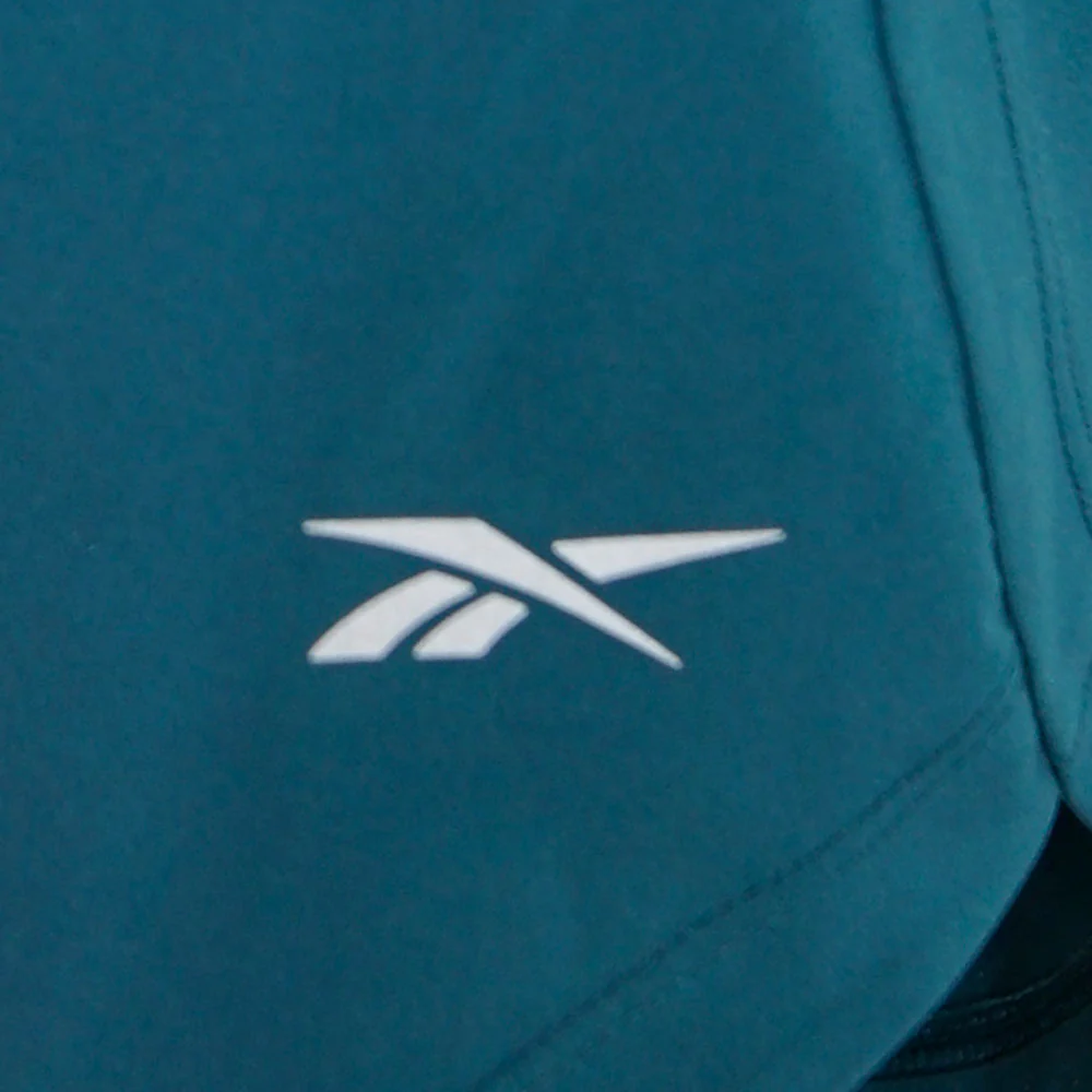 Женские беговые шорты Reebok Lux 6 — цвет зеленый, размер L (американский размер)